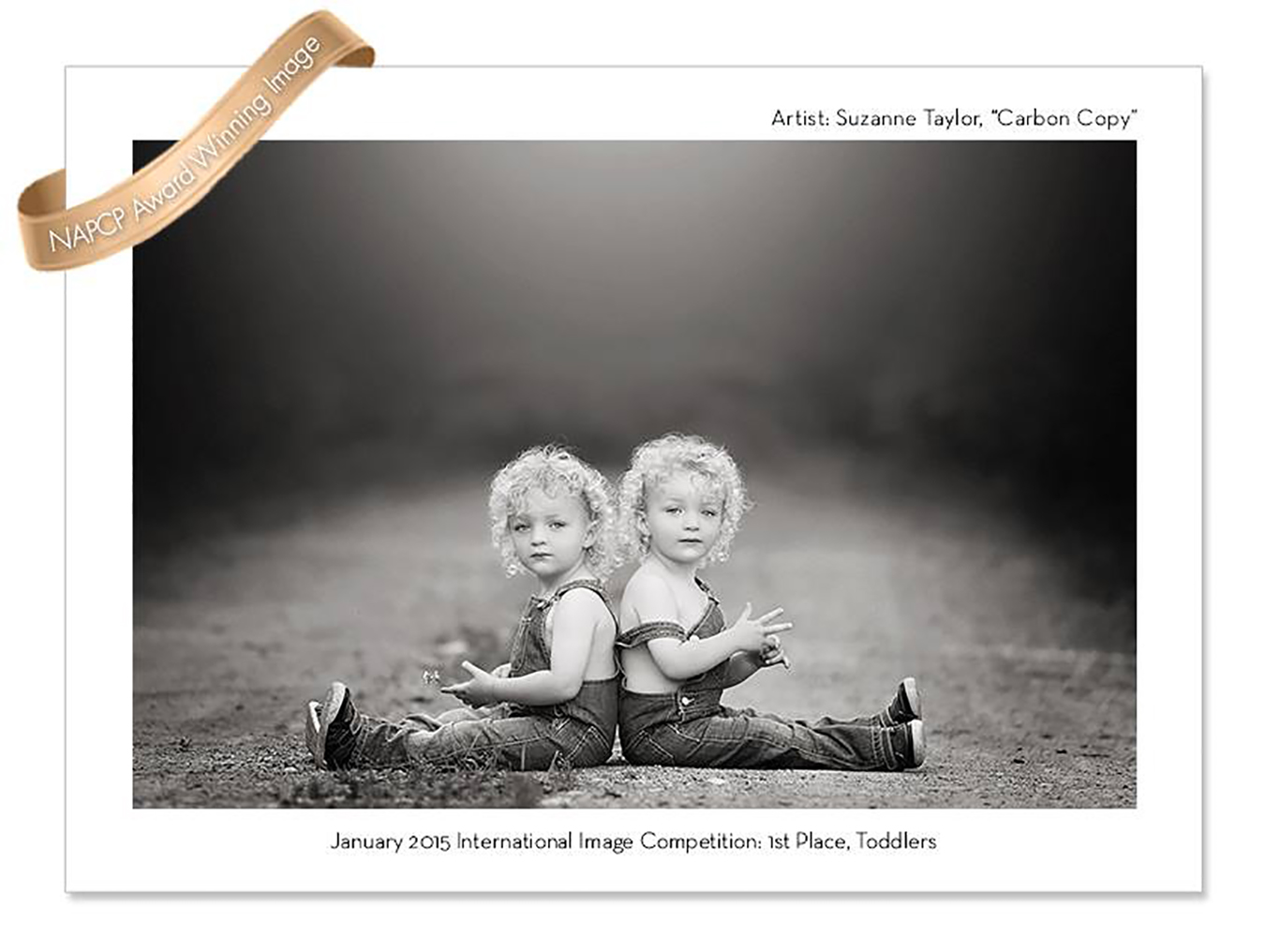 Identical twin boys sitting back to back on a dirt road edited in black and white.