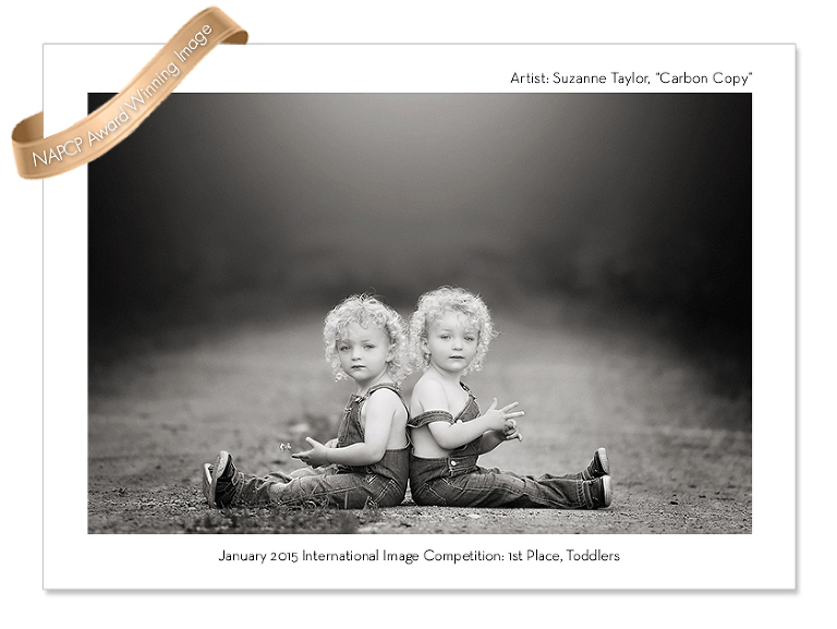 Twins sit back to back on a dirt road near Red Deer, Alberta