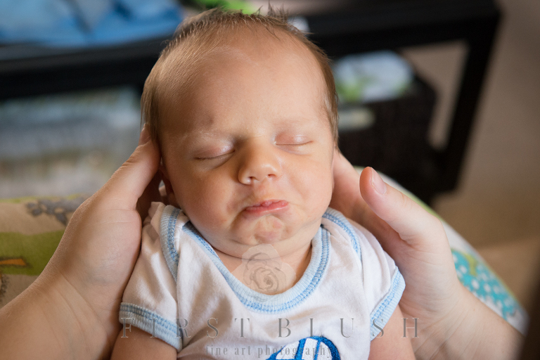 Newborn pouting his lips before feeding