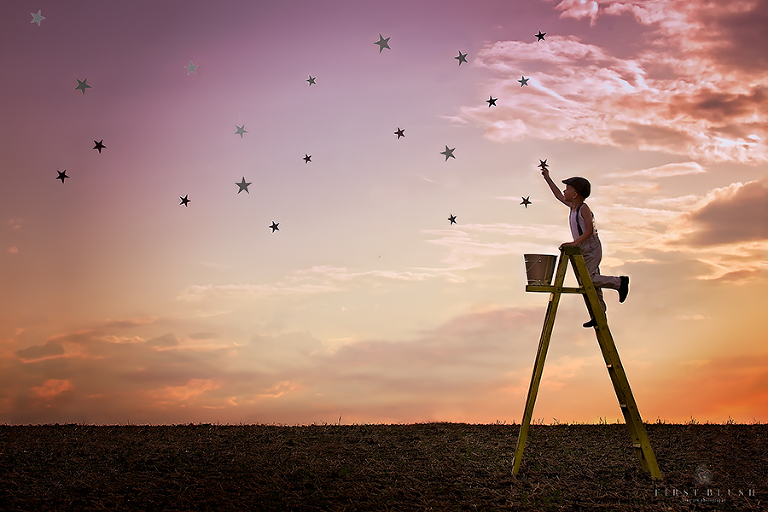 Stars being placed in the sky near red deer alberta by a child on a ladder.