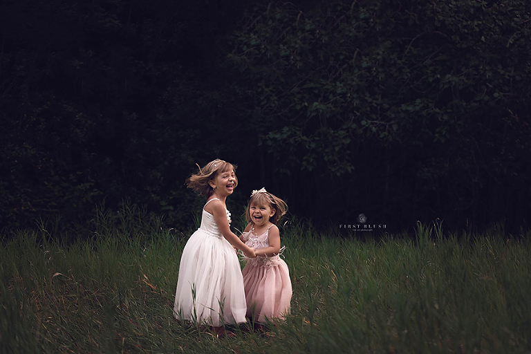 Sisters dancing in dresses by Red Deer Alberta