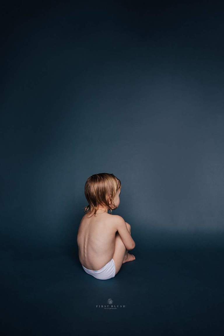 Little girl sitting in white briefs on the floor with wet hair is Unpopular by Red Deer Alberta.